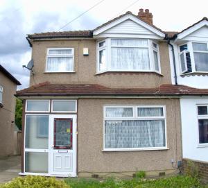 a brick house with white doors and windows at Traditional 3-Bedroom Home- contractors and family in Dartford