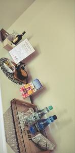 a wall with a shelf with bottles on it at Apartament Studio Michałek Częstochowa in Częstochowa