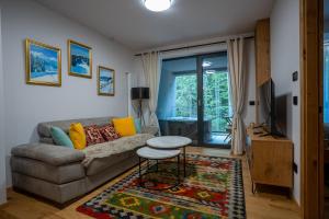 TV a/nebo společenská místnost v ubytování Apartment Aveline