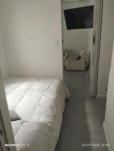 En eller flere senge i et værelse på Departamento La Perla + 10 billeder