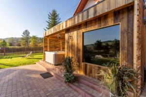 a building with a large window on the side of it at Domek przy Base Camp Pieniny in Niedzica Zamek