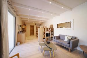 a living room with a couch and a table at Borgo Lianti case vacanza Sardegna in San Pasquale