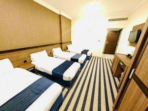 Μια τηλεόραση ή/και κέντρο ψυχαγωγίας στο فندق عصفور 1