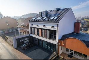a building with solar panels on top of it at Apartamenty Parkowe in Żywiec