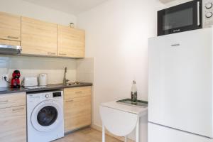 Kuchyň nebo kuchyňský kout v ubytování Le Bleu Marina