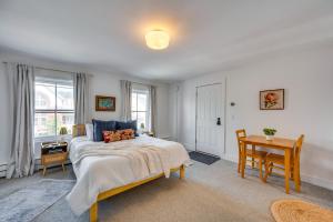 a bedroom with a bed and a table and a desk at Waterbury Studio 12 Mi to Bolton Valley Ski Resort in Waterbury