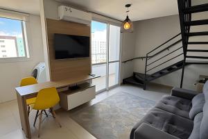 Televisyen dan/atau pusat hiburan di Residencial Veneza - Perto de TUDO! LZN Hospedagens