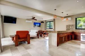 a living room with a couch and a table at Beachfront Soliman Bay Villas for big groups in Balcheil