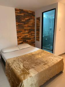 Postel nebo postele na pokoji v ubytování Hotel Coffee Real Pereira