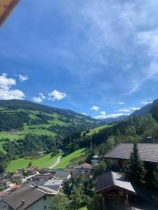 a view of a village in the mountains at Apart Anton in Hainzenberg