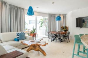a living room with a couch and a table at Hermosa Wave A2 & B2 in Playa Hermosa