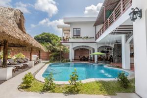 an image of a villa with a swimming pool at Las Golondrinas El Zonte, El Salvador in El Zonte