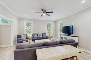 a living room with a couch and a flat screen tv at Beaufort Villas #B in Beaufort