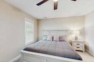 a bedroom with a bed and a ceiling fan at Beaufort Villas #B in Beaufort