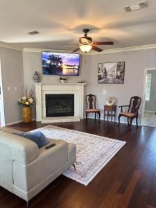 a living room with a couch and a fireplace at Exotic Abode - Luxury Double Rooms in Denton +48 photos