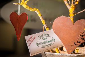 a couple of hearts hanging from a tree at Hotel Karl-Wirt in Perchtoldsdorf