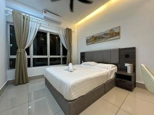 a bedroom with a large bed and a window at KL ,2BR 2Bath Condo ,Razak city ,TV box&Pool in Kuala Lumpur