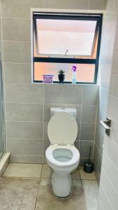 Koupelna v ubytování Cozy abode + 6 fotografií