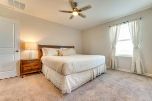 a bedroom with a bed and a ceiling fan at Pool Access Family Gem with Views in St Cloud! in Narcoossee +30 photos
