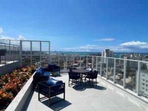 En balkon eller terrasse på Peracanga Bacutia Guarapari LS05