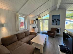 a living room with a couch and a table at Strandhaus Dünenpark 1c in Priwall