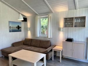a living room with a couch and a table at Strandhaus Dünenpark 1c in Priwall