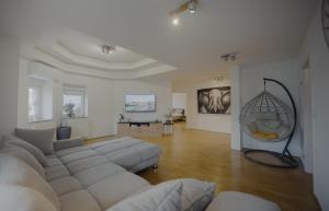 a large living room with a couch and a mirror at Rezidenca Vista Lux in Ptuj