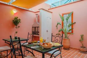 a room with a table with fruit on it at Riad Dar Z'r in Marrakesh