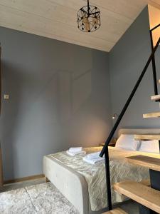 a bedroom with a bed and a wall at Field house in Slavske