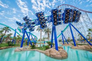 a roller coaster in the water at a theme park at グループ宿泊に最適 Spacious Home Base by Yadoya in Yokkaichi