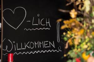 a chalkboard with a heart and the words lickilation istg at Hotel Karl-Wirt in Perchtoldsdorf