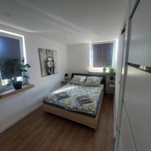 Ένα ή περισσότερα κρεβάτια σε δωμάτιο στο Apartament MiKaTy