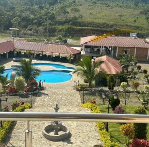 a view from the balcony of a resort at Hosteria Mana in El Pangui