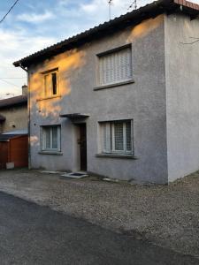 a house with the sun shining on the side of it at La belle époque in Bourg-en-Bresse