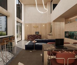 eine Lobby mit einem Sofa und einem Tisch und Stühlen in der Unterkunft Brada Collection Stays in Guadalajara