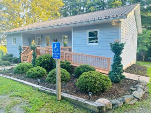a small house with a handicapped sign in front of it at Bee Happy Sparta Mountain Cottage in Sparta