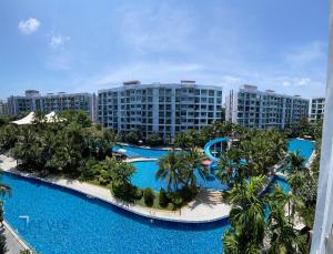an aerial view of the pool at a resort at Dusit Grand Park - Modern Studio Pool View in Jomtien Beach