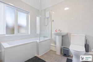 a white bathroom with a toilet and a sink at Abbie's House in Nottingham +23 photos