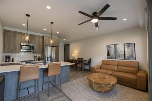 a kitchen and living room with a couch and a table at Romantic 1BR Getaway Across from Purgatory Resort in Durango Mountain Resort