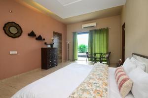 Ένα ή περισσότερα κρεβάτια σε δωμάτιο στο Nivas Farmstay