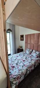 a bedroom with a large bed with a canopy at Pełen Wypas - Dziadówka in Przeworno