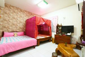 Voodi või voodid majutusasutuse Time Travelodge Homestay toas