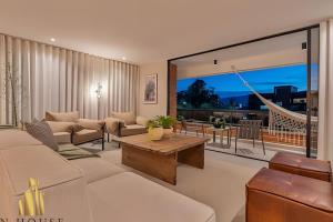 a living room with a couch and a table at Tivoli 202 - Escapada Premium con Jacuzzi Privado in El Poblado