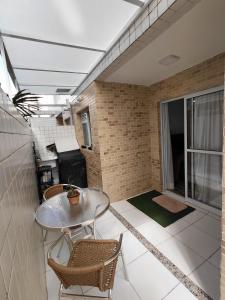 Χώρος καθιστικού στο Apartamento 5min da praia, estacionamento, pet friendly