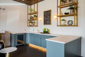 a kitchen with blue cabinets and a counter at The Star on Spring in Springdale