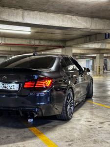 a black car parked in a parking garage at BMW 535i in Tbilisi City