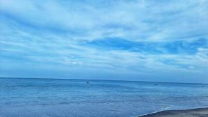a view of the ocean on a cloudy day at The Corner Hostel in Playa Blanca