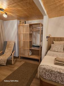 a bedroom with a bed and a chair in a room at BEACH Arguineguin SEA VIEW 7 CHG FAMILY HOTEL in Arguineguín