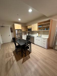 a kitchen with a table and chairs in a room at 1BR in Hollywood w patio & parking!! in Los Angeles