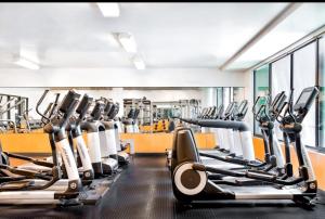 a gym with rows of treadmills and machines at 1BR in Hollywood w patio & parking!! in Los Angeles